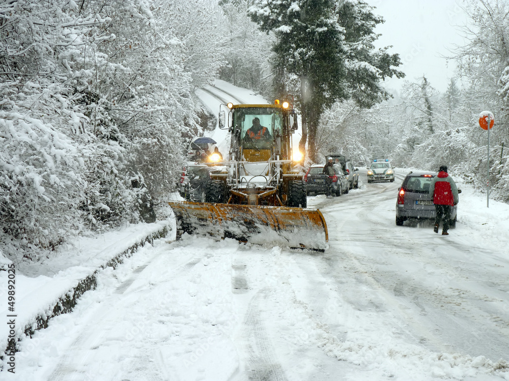 snowplow open road in winter time