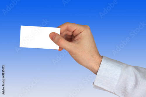 Businessman's Hand with blank credit Card on blue Background
