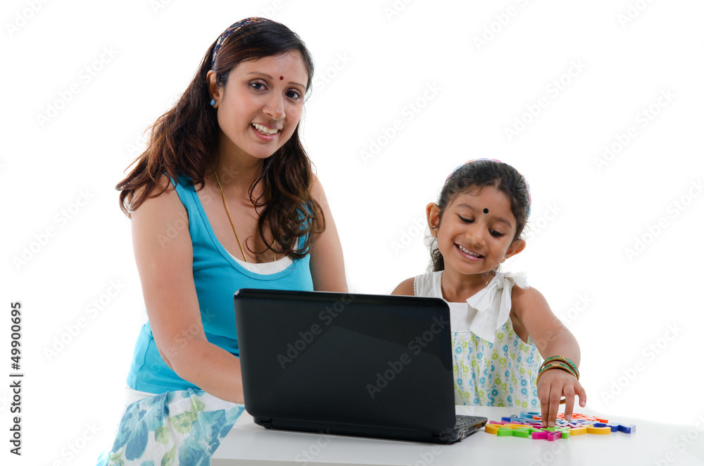 happy looking indian mother and daughter happy looking indian mother and daughter