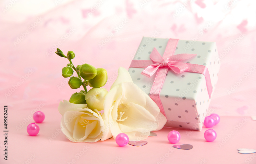 Beautiful romantic gift box and flower on pink background Beautiful romantic gift box and flower on pink background