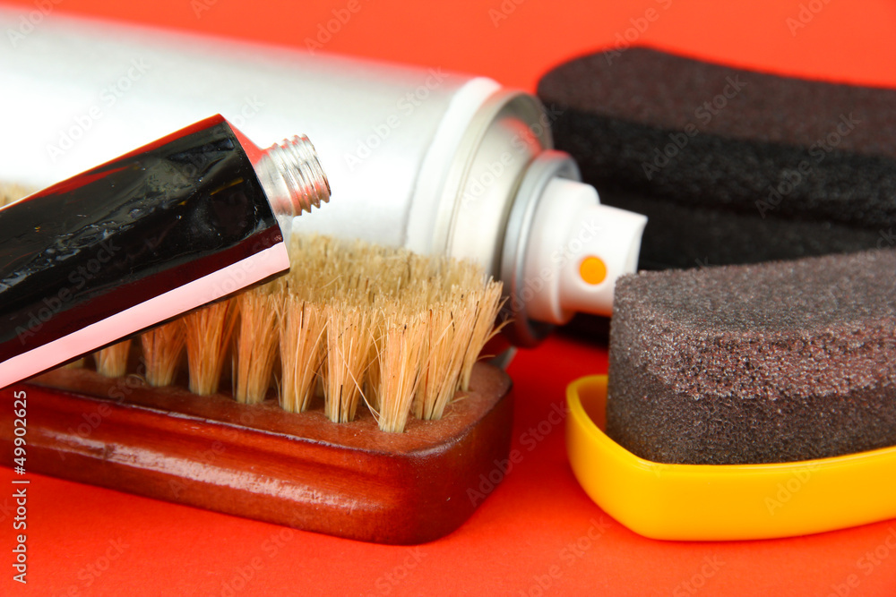 Set of stuff for cleaning and polish shoes, on color background Set of stuff for cleaning and polish shoes, on color background