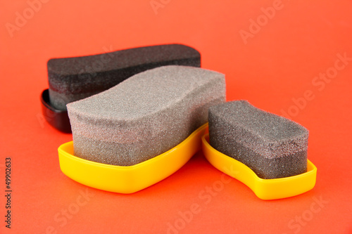 Shoe shine sponges, on color background