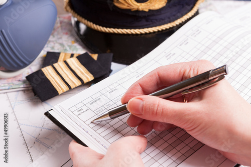 Airplane pilot filling in flight plan