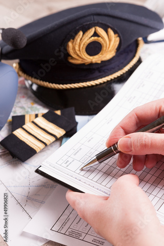 Airplane pilot filling in flight plan