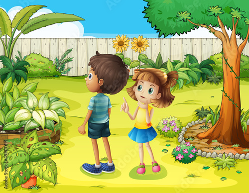 A boy and a girl discussing in the garden