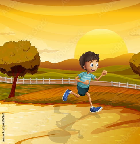 A view of the afternoon with a young boy running