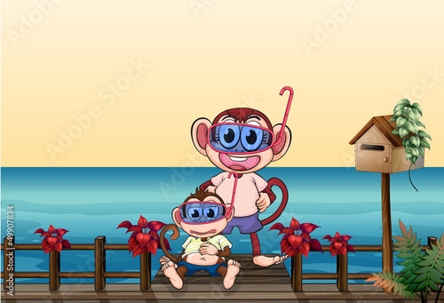 A small and a big monkey at the bridge © GraphicsRF