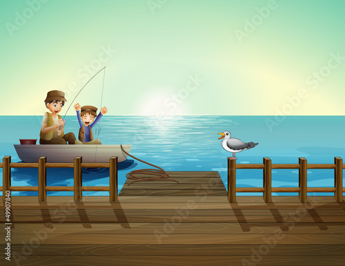 A father and a child fishing near the bridge