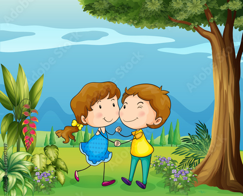 A girl and a boy dancing at the park