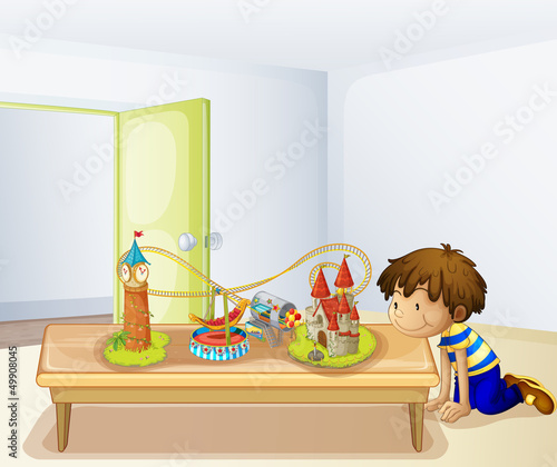 A boy looking at his toys