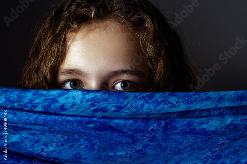 Little girl face covered with veil