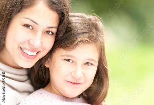 Happy young mother with her small daughter.