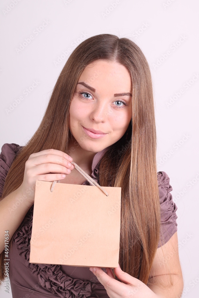 Beautiful long-haired girl with shopping bags Beautiful long-haired girl with shopping bags