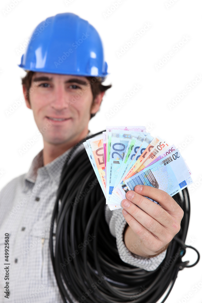 Electrician showing wad of bills