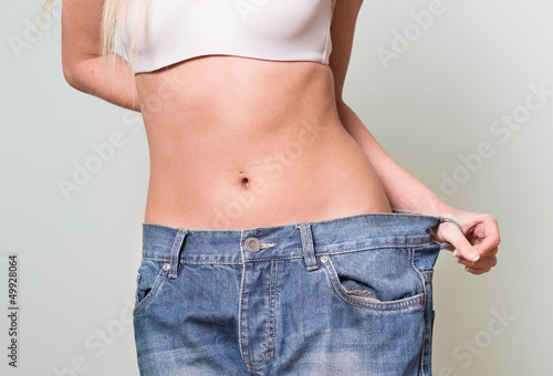 Attractive woman wearing too large pants