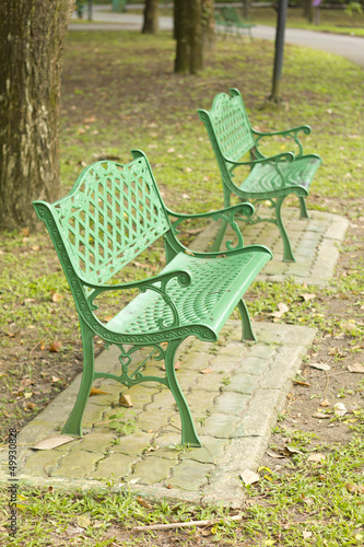 metal garden chair in beautiful garden © singkamc