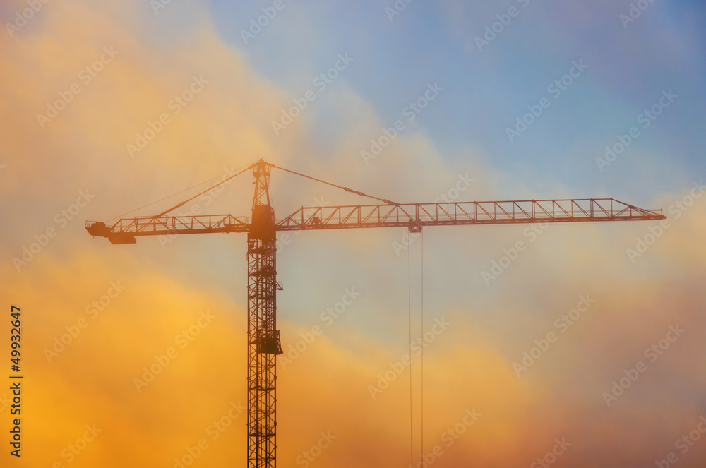 lifting crane in bright cloud