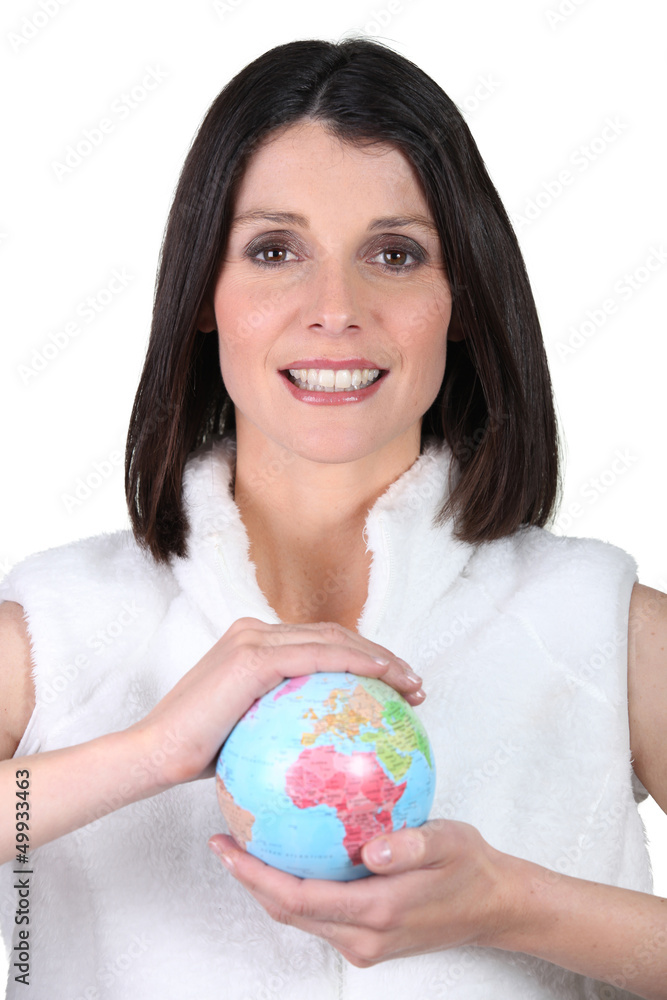 Woman holding a mini-globe