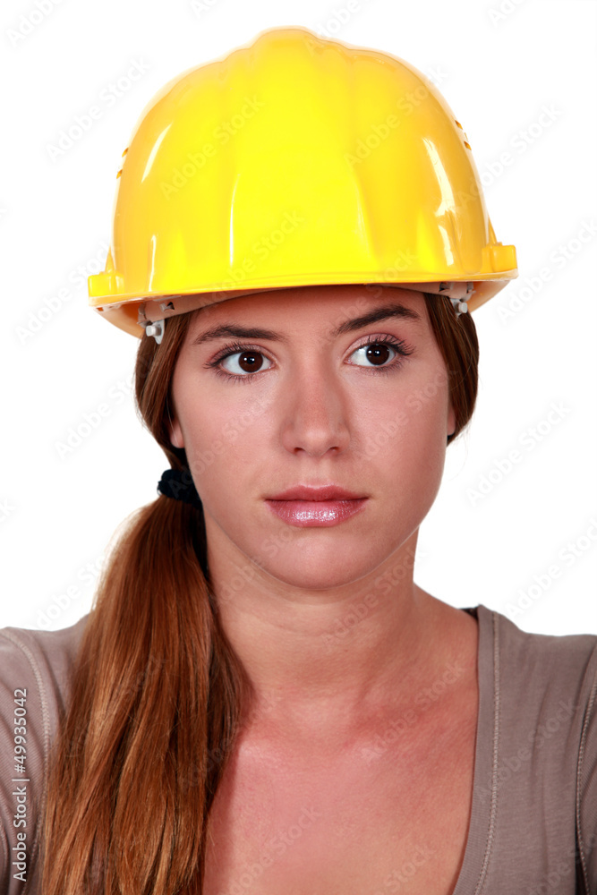 Businesswoman in a hardhat making a heart with her hands Businesswoman in a hardhat making a heart with her hands