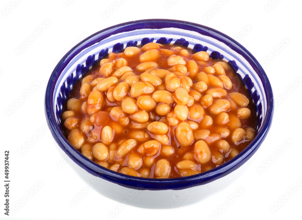 Marinated haricot beans in tomato sauce with shallots on a plate Marinated haricot beans in tomato sauce with shallots on a plate