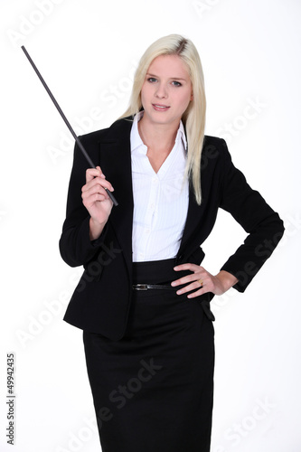 Blond instructor holding stick