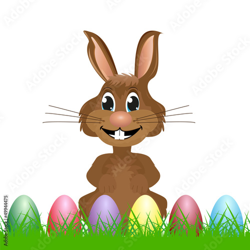 rabbit with easter eggs on the grass