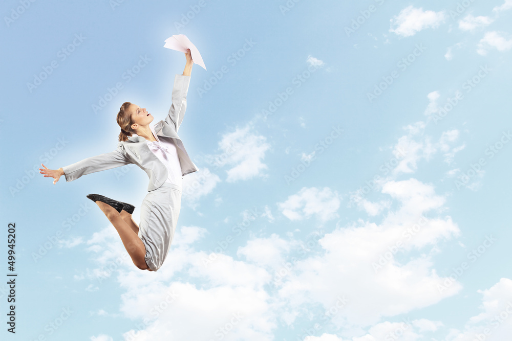 Obraz premium Image of jumping businesswoman