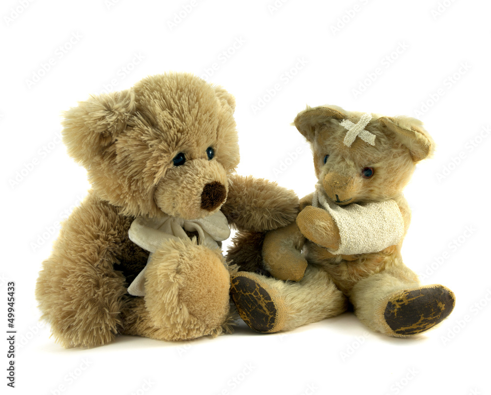 Teddy with arm in sling being comforted. Teddy with arm in sling being comforted.