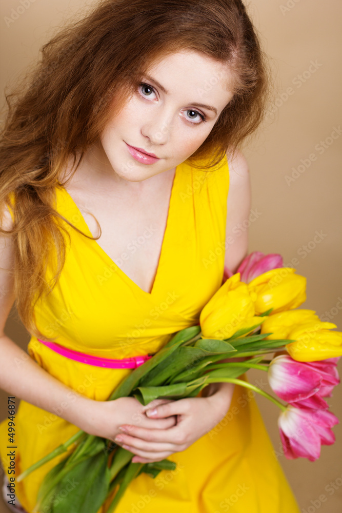 Beautiful redheaded girl with tulips Beautiful redheaded girl with tulips