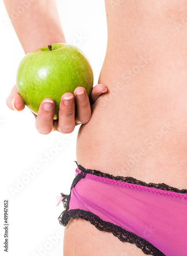 Fotografie, Obraz young girl with perfect body and apple in hand