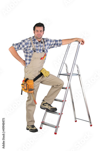 Laborer leaning on a ladder isolated on white background