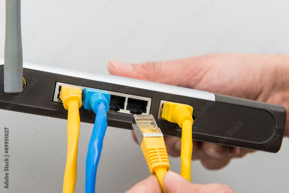Router, Netzwerkkabel anschließen #bn Stock Photo | Adobe Stock
