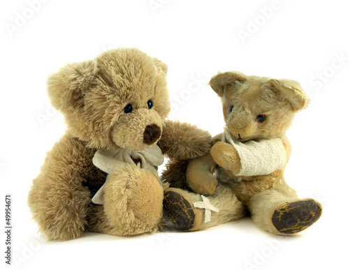 Teddy with arm in a sling and plaster on leg. © annacurnow