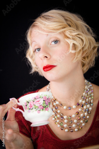 Fotografía Beautiful Snobbish lady holding a cup of tea