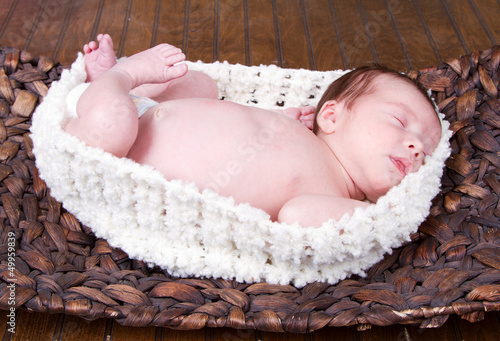 Baby laying in a basket
