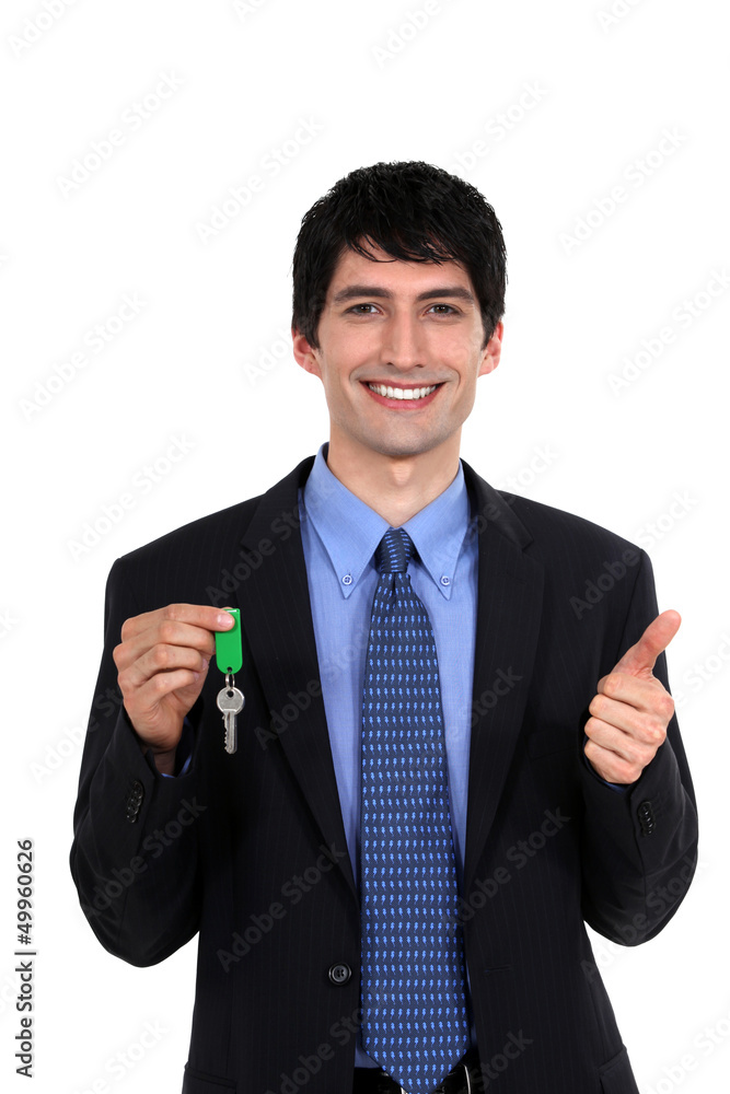 Car salesmen holding keys