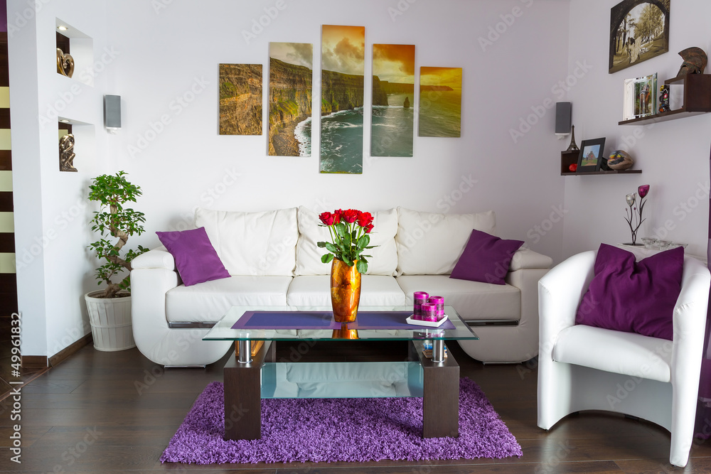 Fototapeta premium Modern lliving room interior with canvas on the wall
