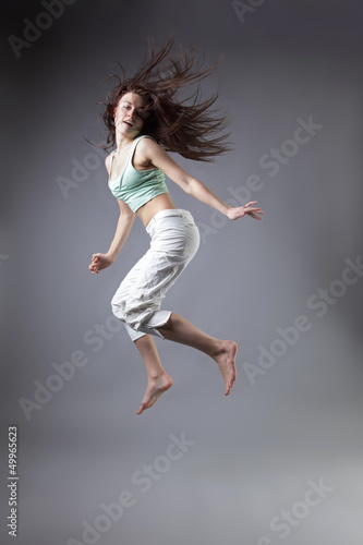 beauty girl dance on grey background