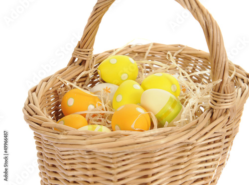 basket with easter eggs  isolated on white