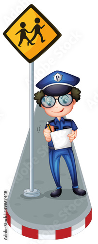 A policeman writing with a yellow signage