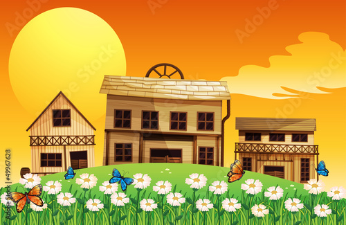 Three wooden houses with flowers