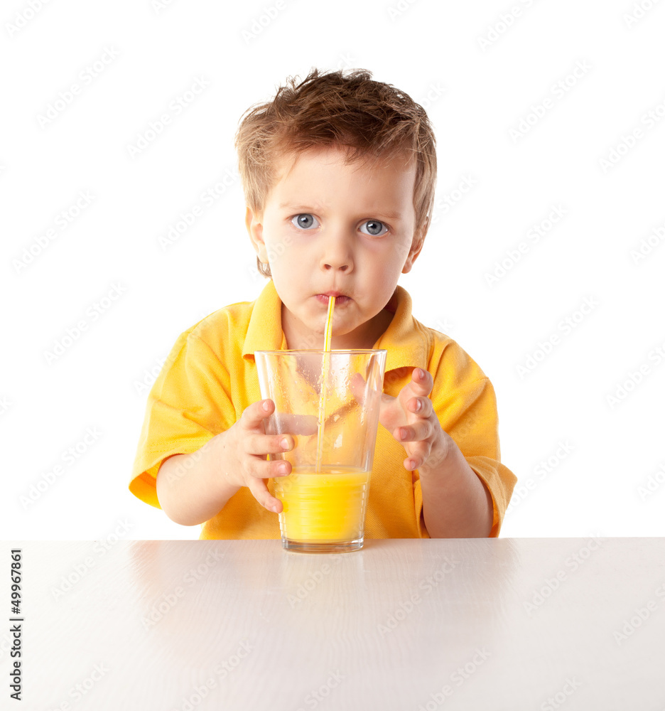 Portrait of happy little boy drinking orange juice. Isolated Portrait of happy little boy drinking orange juice. Isolated