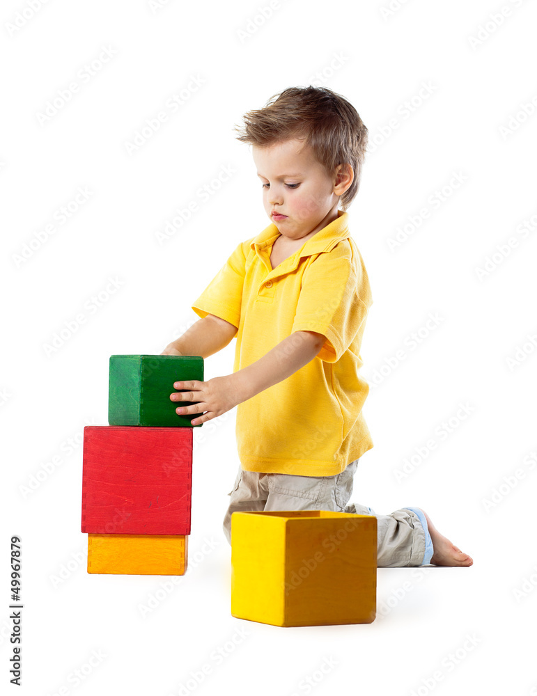 little boy plays with cubes, isolated on white little boy plays with cubes, isolated on white