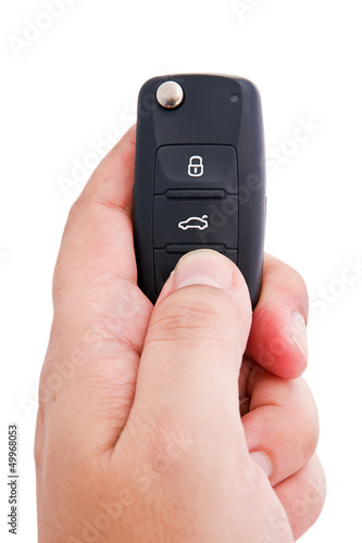 Obraz na plátně Man hand holding a garage door remote control