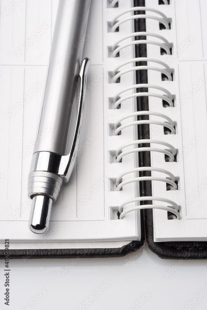 Close-up open scratchpad with pen Close-up open scratchpad with pen