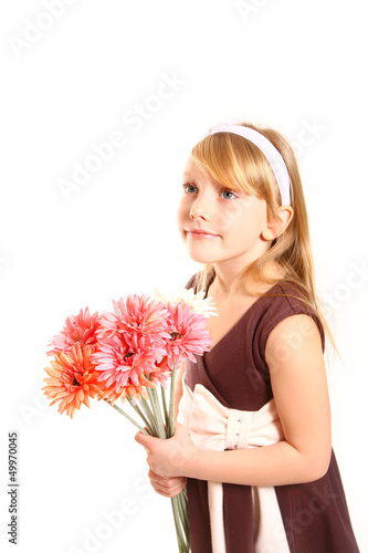 Portrait of little girl with gerberas on a white background