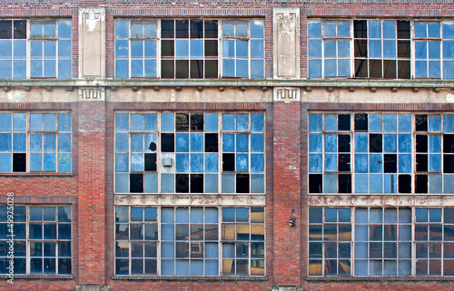 Broken windows on old derelict building