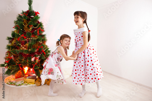girls at a New Year tree