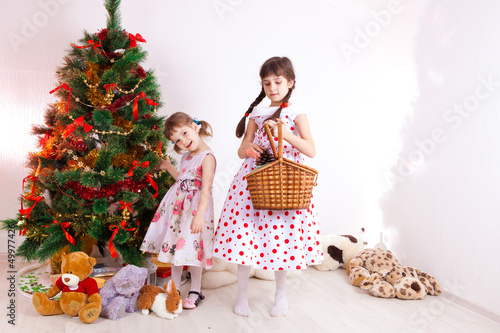 girls at a New Year tree