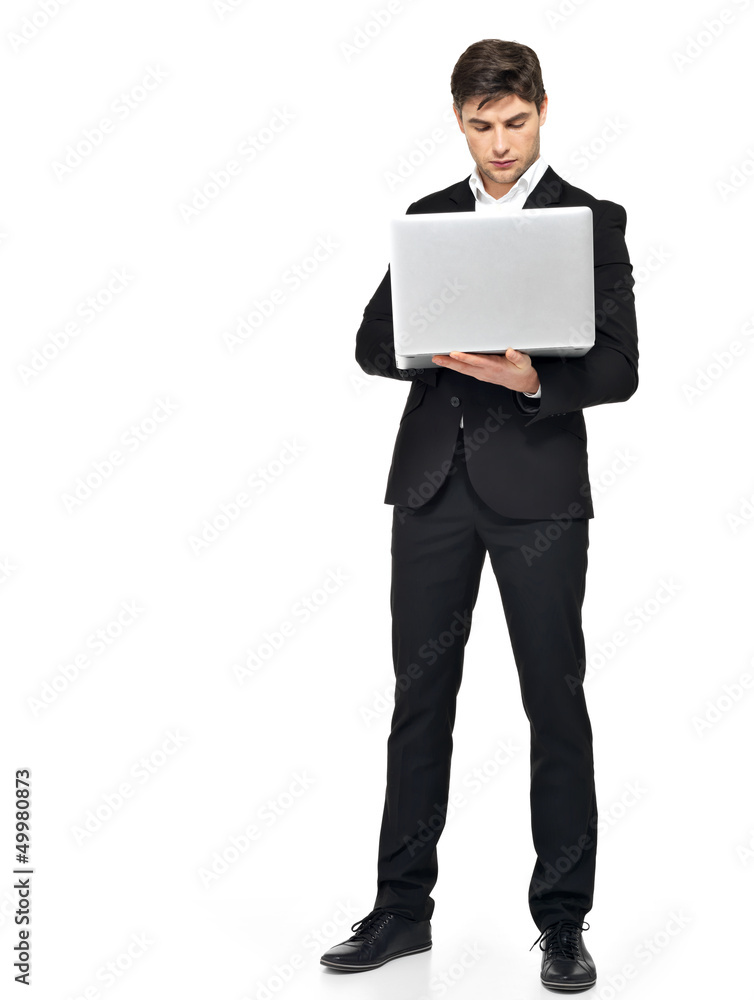 Full portrait of businessman working on laptop Full portrait of businessman working on laptop